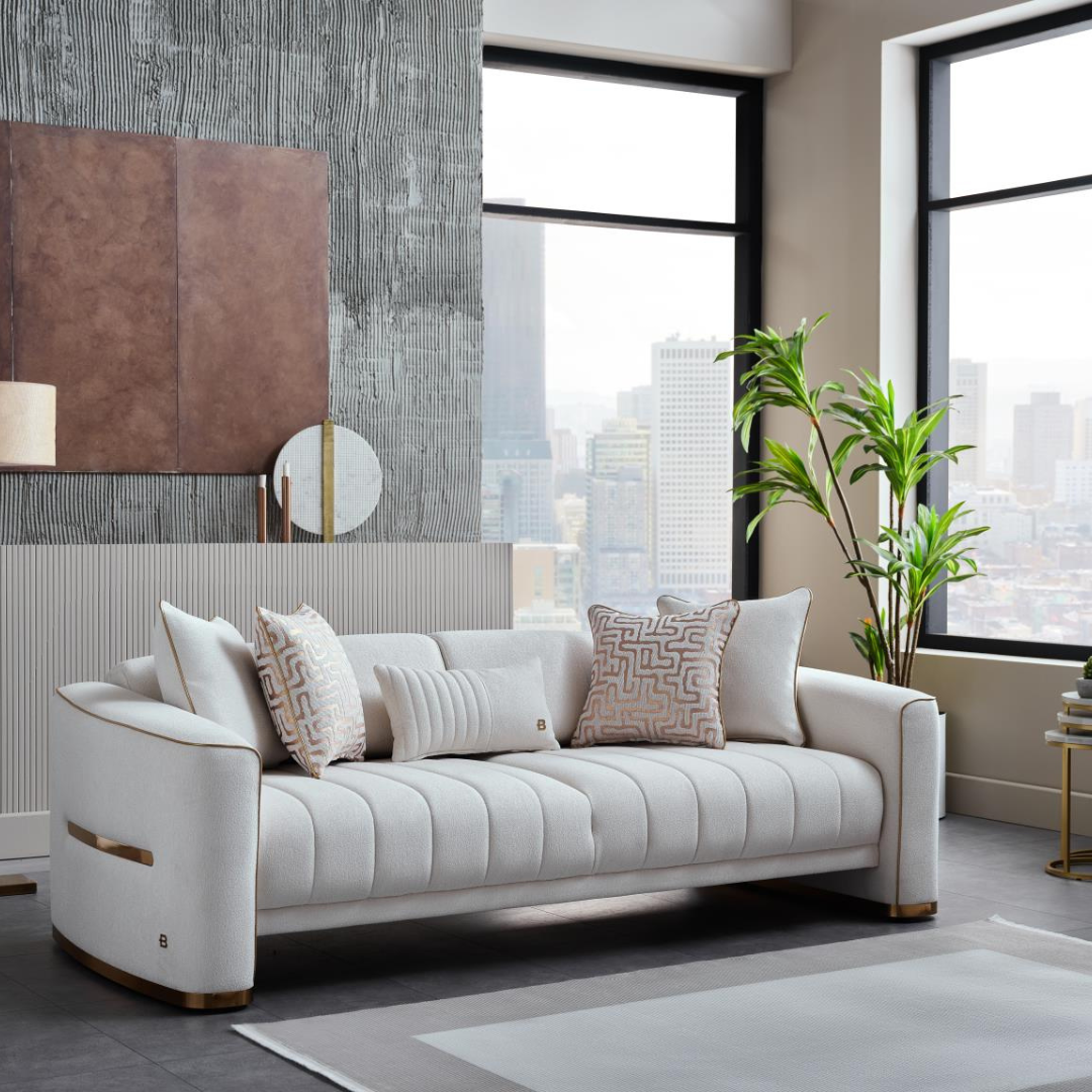 Modern white tufted sofa with gold accents, decorative pillows, in stylish living room with city view