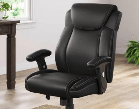 Black leather office chair with headrest and armrests in modern home setting