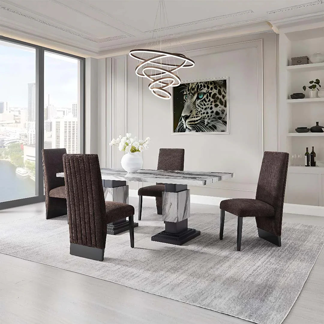 Modern dining room set with marble table, brown upholstered chairs, and leopard art under spiral chandelier