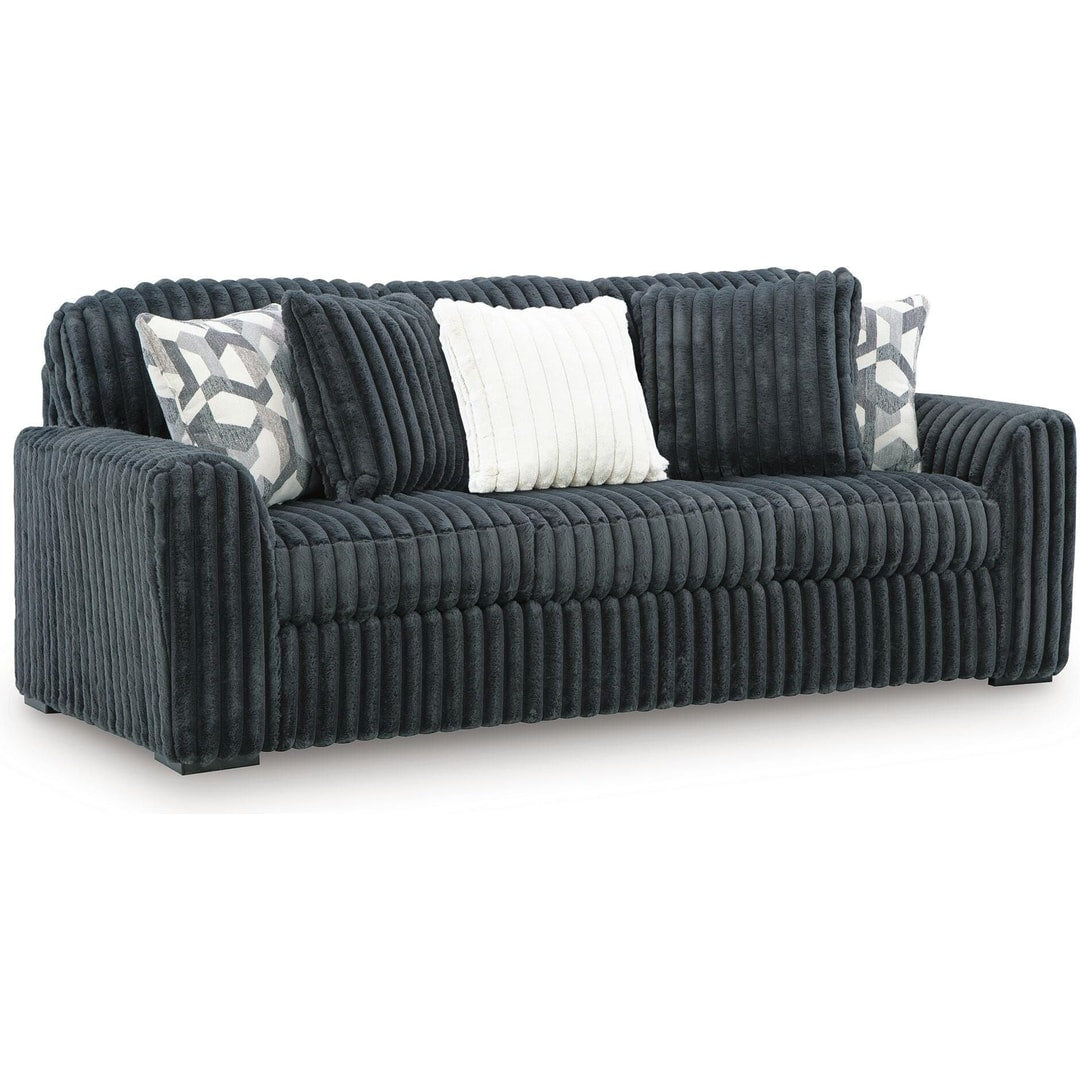Midnight Madness sofa in Gunmetal jumbo corduroy with accent pillows, three-quarter front view on a white background