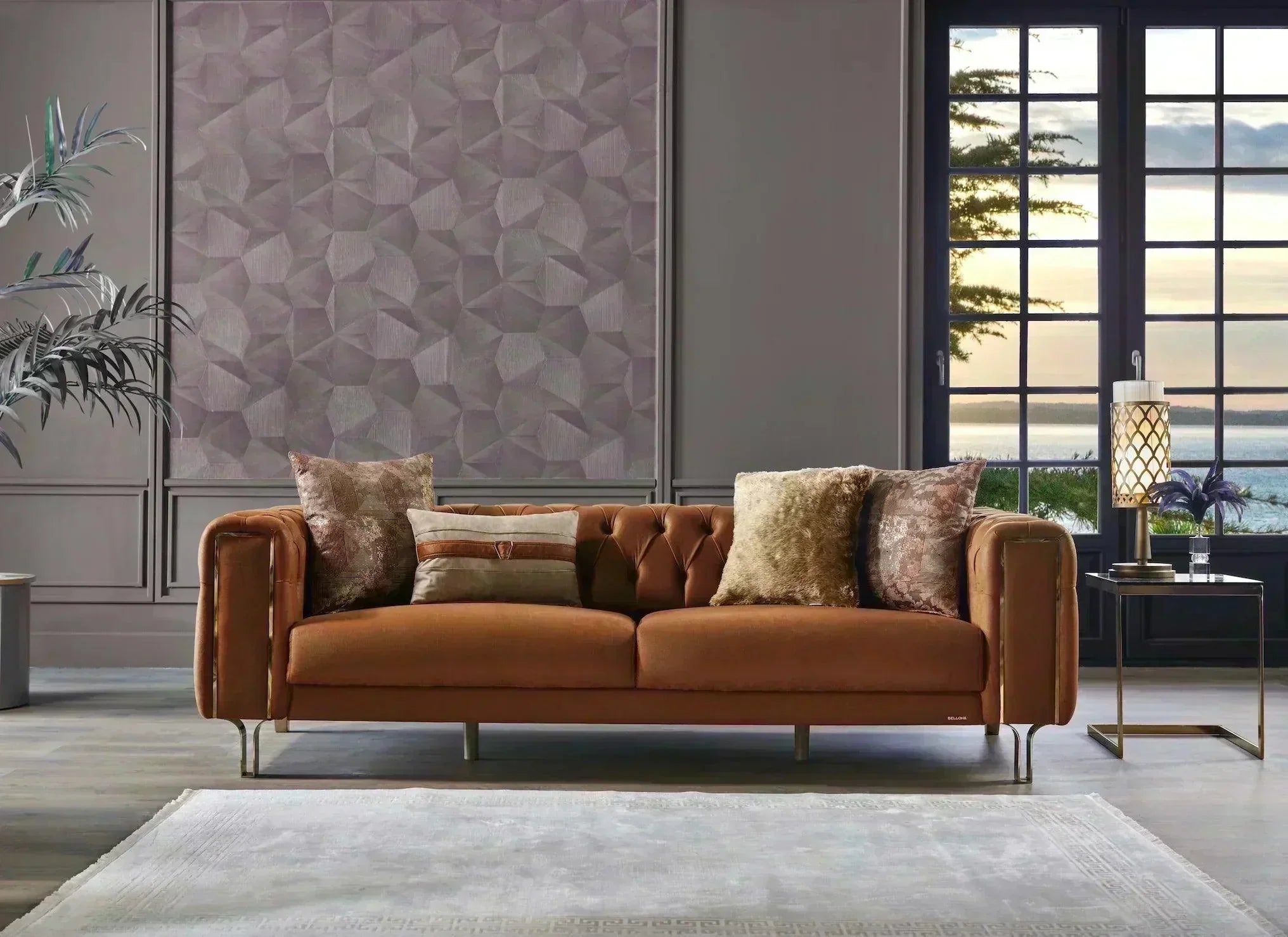 Modern brown velvet sofa with tufted back, decorative pillows, and geometric wall panel in stylish living room