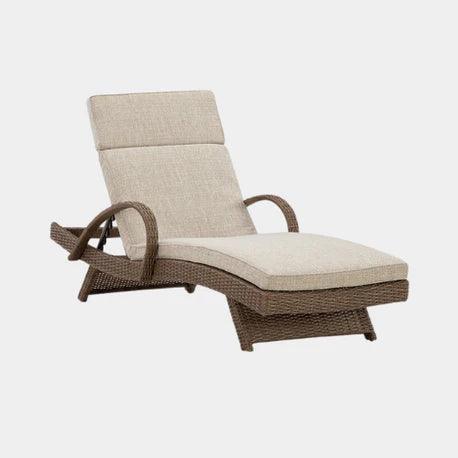 Wicker chaise lounge with beige cushion, modern outdoor patio furniture for relaxing in style