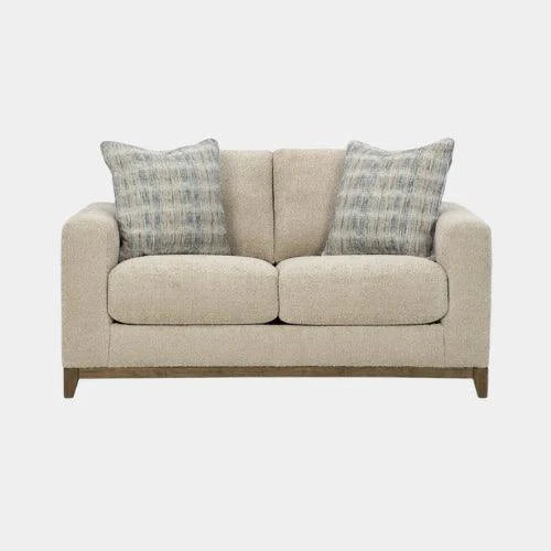 Beige modern loveseat with textured fabric and patterned throw pillows, ideal for cozy living room decor