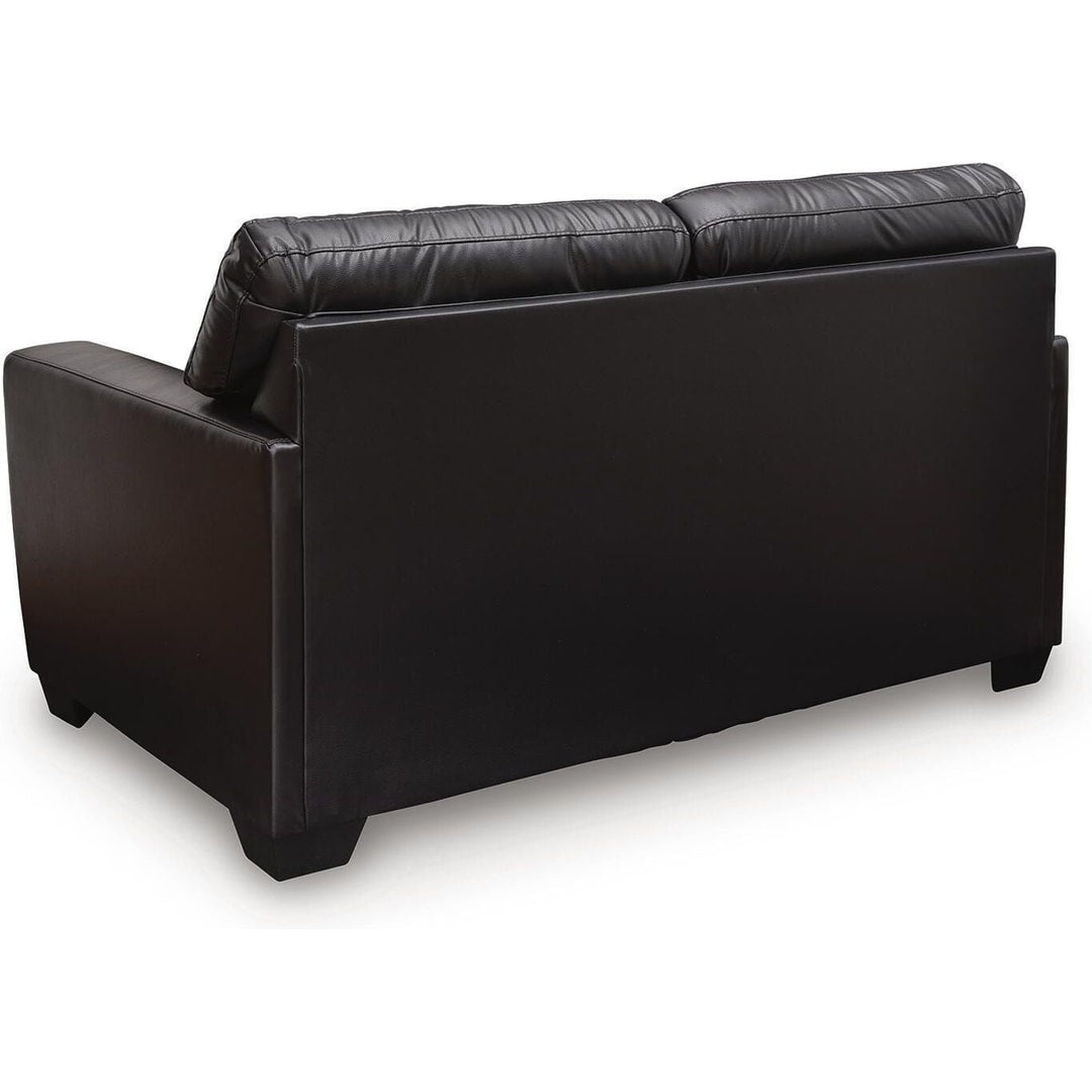 Rear three-quarter view of the gavello loveseat, showing the finished back and low-profile legs