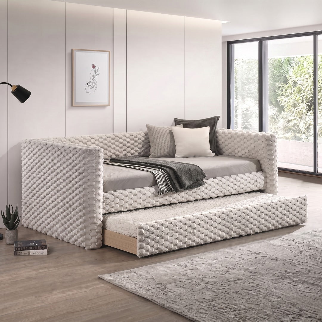 Brielle Daybed in dove-white textured fabric with pull-out trundle, styled in a modern living room