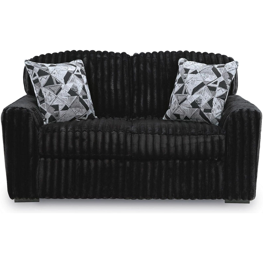 Midnight Madness loveseat in Onyx jumbo corduroy, straight-on front view showing the wide-wale ribbing